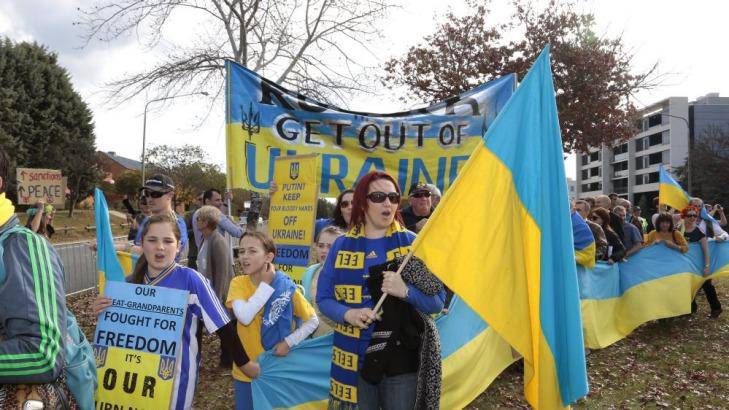 The protesters voice their anger in front of the Russian embassy in Canberra. Photo: Jeffrey Chan